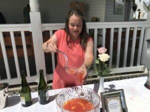 Volunteer Mary Lovelein Serving Cranberry Punch